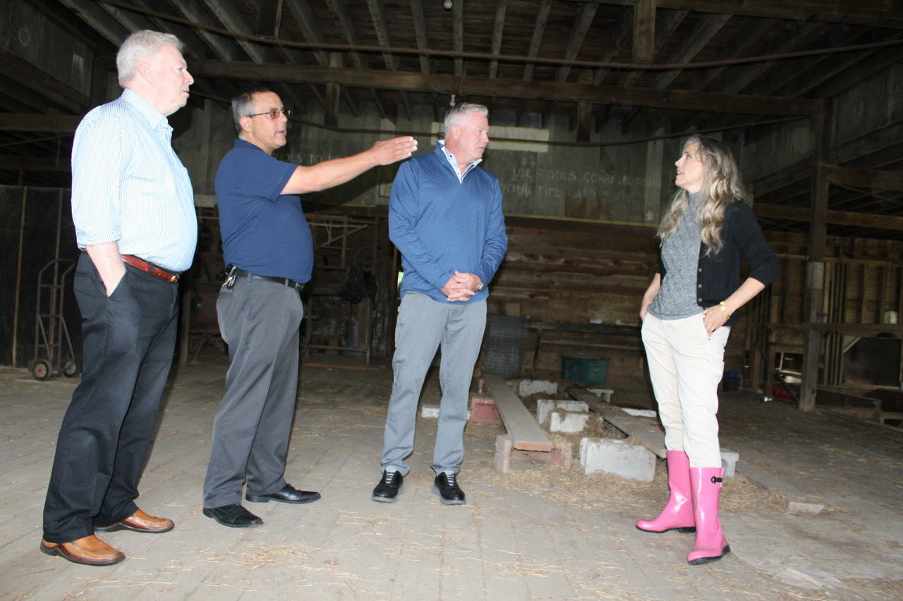 (Left to right) Suffolk County director of historic services Richard Martin; Suffolk County Legis. Dominick Thorne; councilman Neil Foley; and Susan Shiebler in the Avery barn, discussing its use.